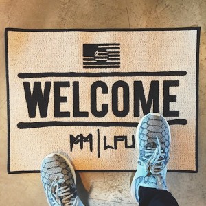 Photo of a Fort Minor 'Welcome' mat.